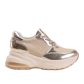 Gyllene sneakers med tjocka Amy -sulor