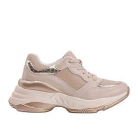 Gyllene sneakers med en tjock Lydia -sula beige