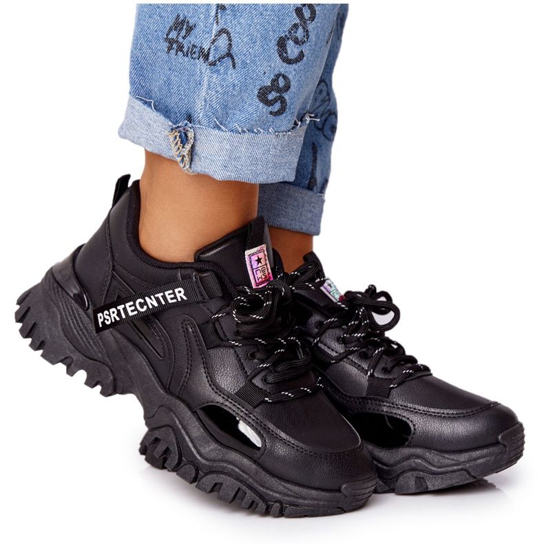 EVE Kvinnors sneakers på en massiv svart skratt sula