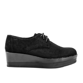 Svarta mockaskor på en hög Elisabeth -sula