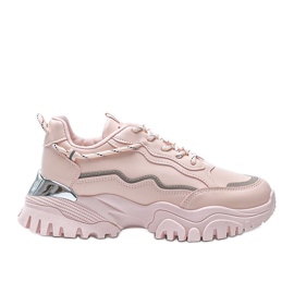Rosa sneakers på en tjock Desiare -sula