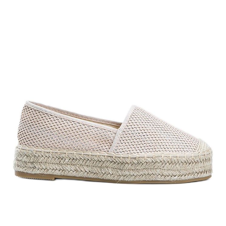 Beige espadriller på en tjock Lia -sula