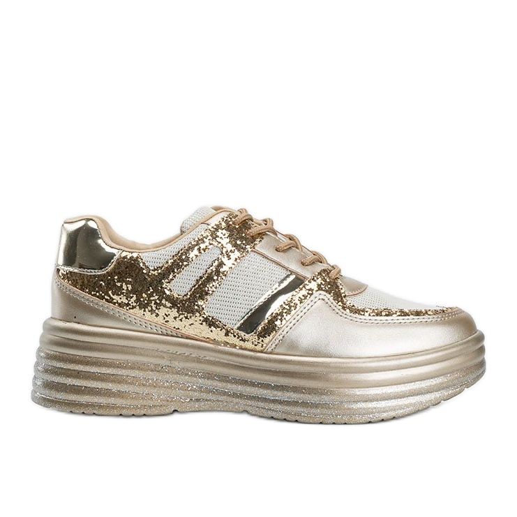 Guldglittriga sneakers med en tjock Laurel -sula gyllene