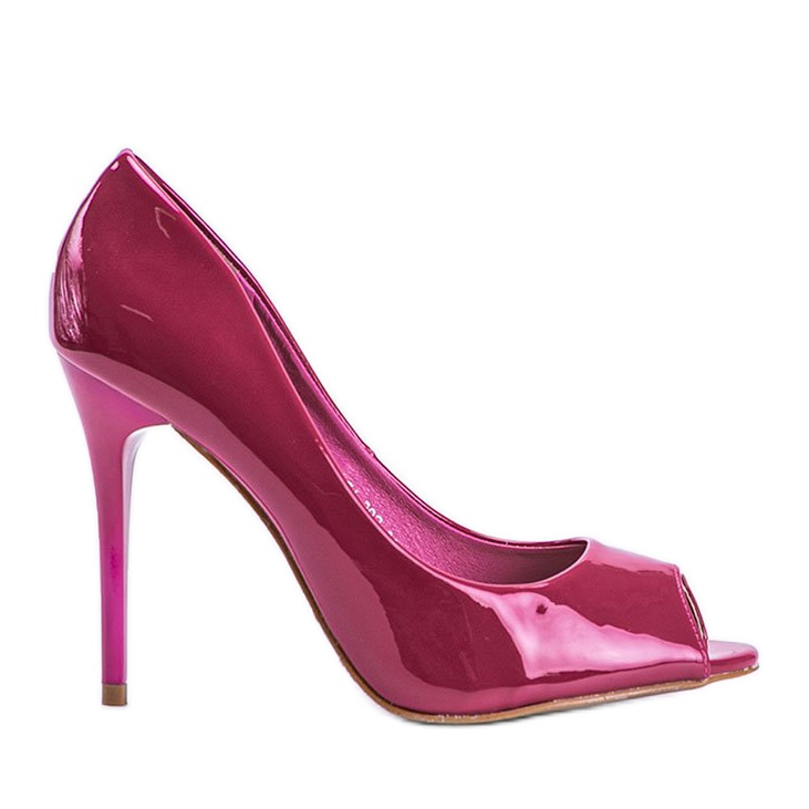 Rosa pumps lackerade på en Luke -häl