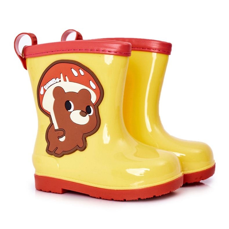Barnens gula galoscher med en nalle