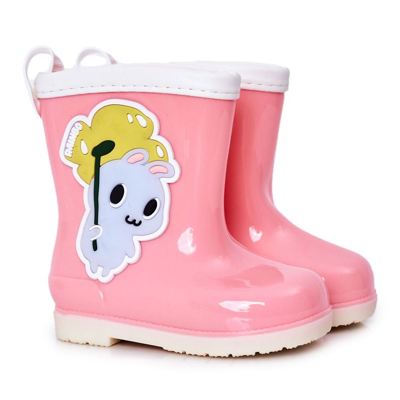 Barnens rosa regnstövlar med en kanin