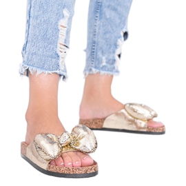 Guldtofflor med Norris rosett gyllene