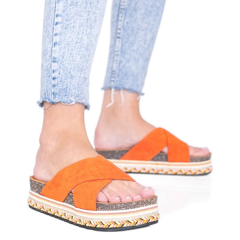 Orange tofflor med dekorativ Riri -sula