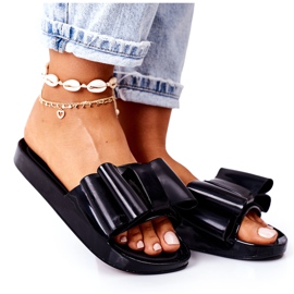 PS1 Gummi tofflor med rosett svart april