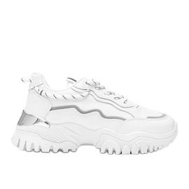 Vita sneakers på en tjock Desiare -sula