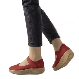 Röda skor på en tjock Lumen -sula