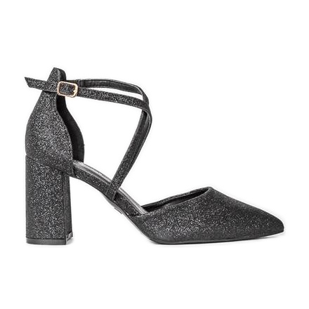 Svarta pumpar på den blanka stolpen