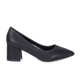 Svarta glödande pumpar på Laitas stolpe