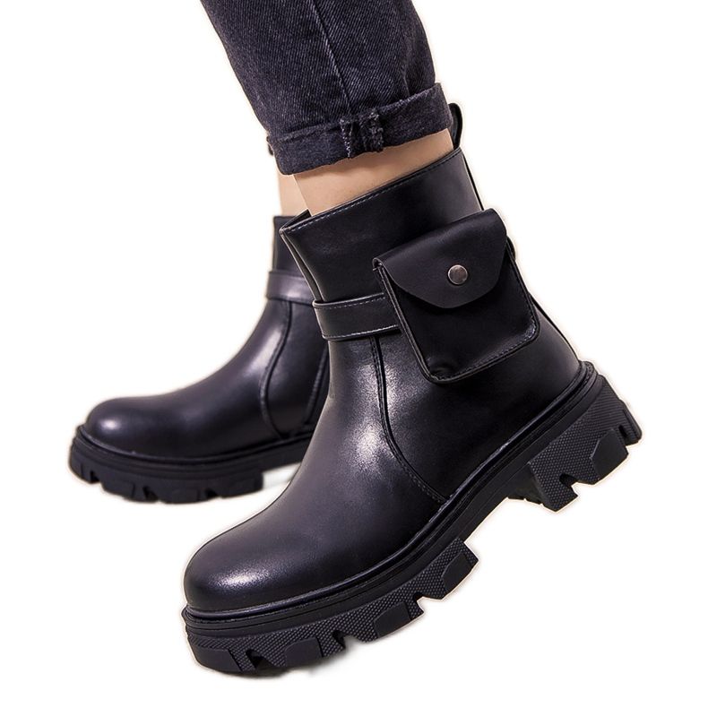 Svarta isolerade stövlar med Millikin-påse