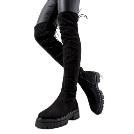 Svarta stövlar på hög Paulino-sula