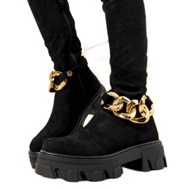 Svarta stövlar på tjock Alines sula