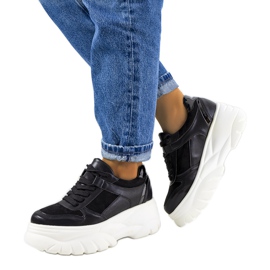 Svarta sportsneakers med hög Mellis-sula