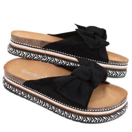 Flip-flops på en dekorerad Lane Black sula svart