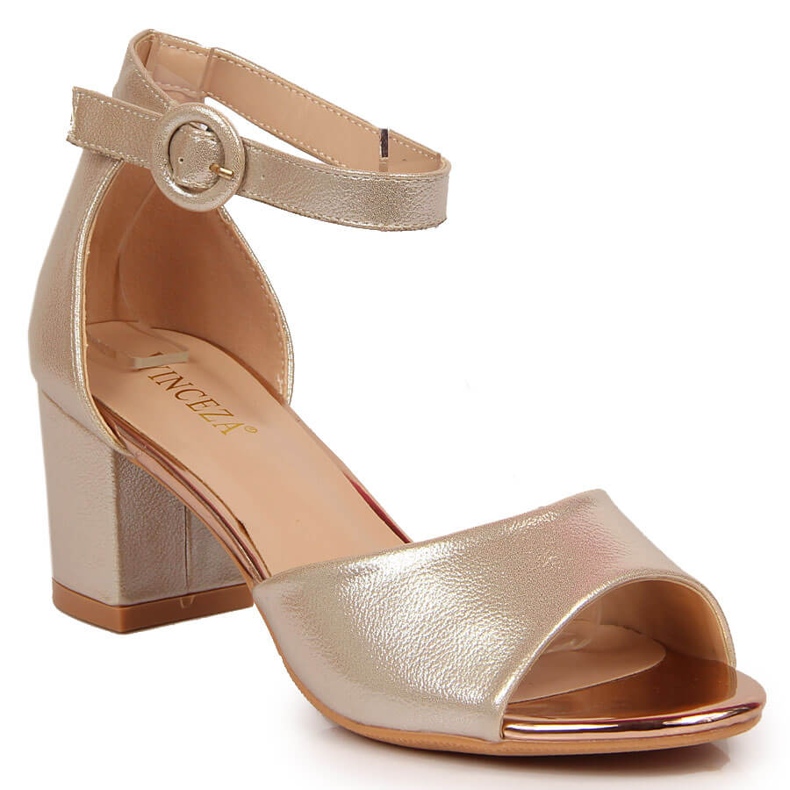 Gyllene Vinceza damsandaler på stolpen