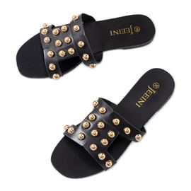 Svarta tofflor med dekorativa Amparo nitar