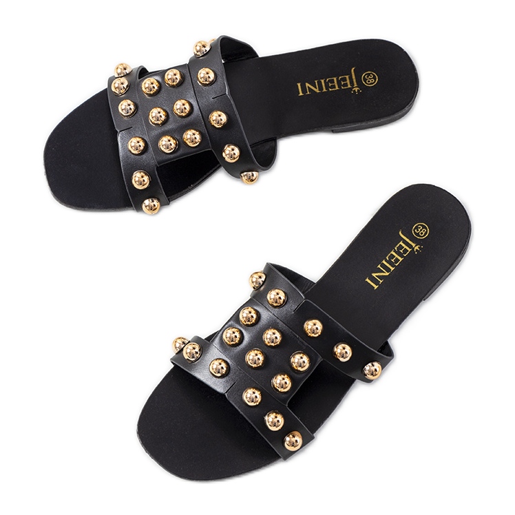 Svarta tofflor med dekorativa Amparo nitar