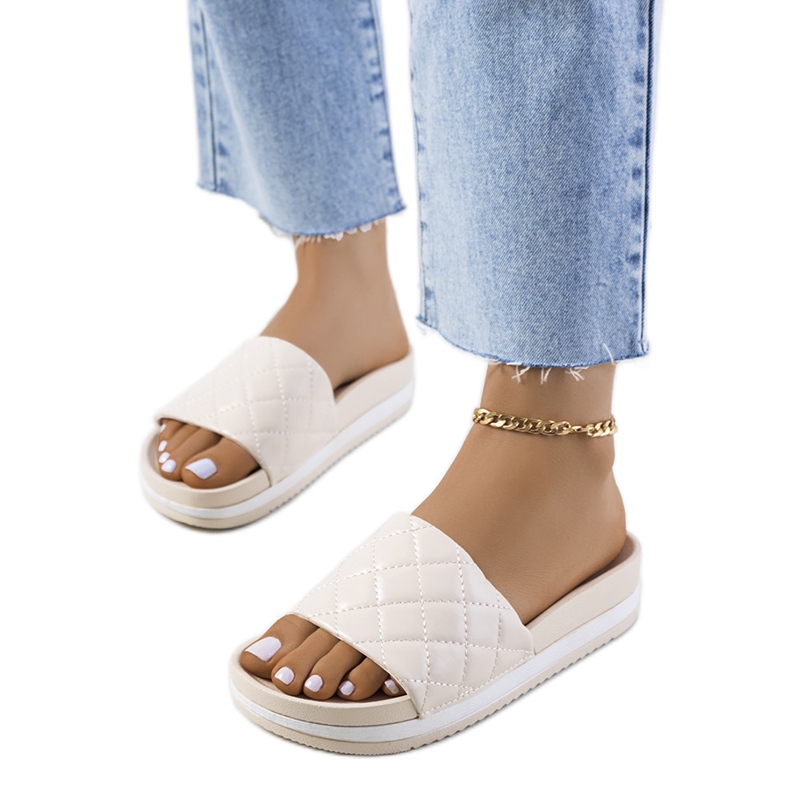 Beige Hassell quiltade tofflor