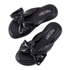 Svarta tofflor med Roio rosett