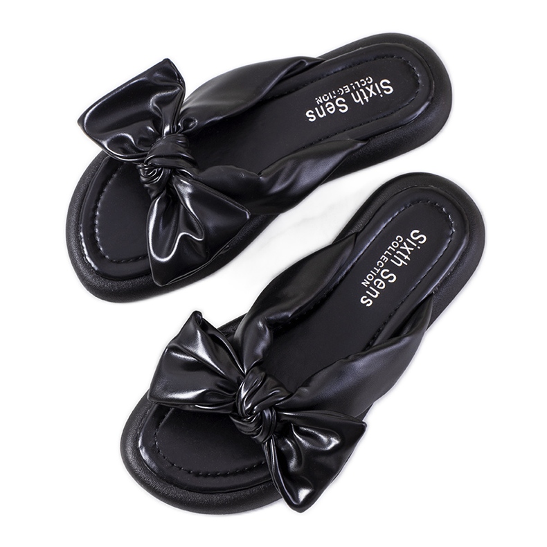 Svarta tofflor med Roio rosett