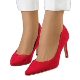 Röda pumps på en Kauri-klack