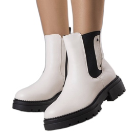 Krämisolerade stövlar från Caron beige