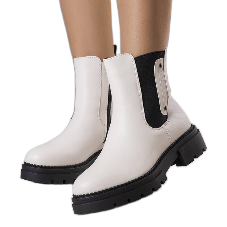 Krämisolerade stövlar från Caron beige