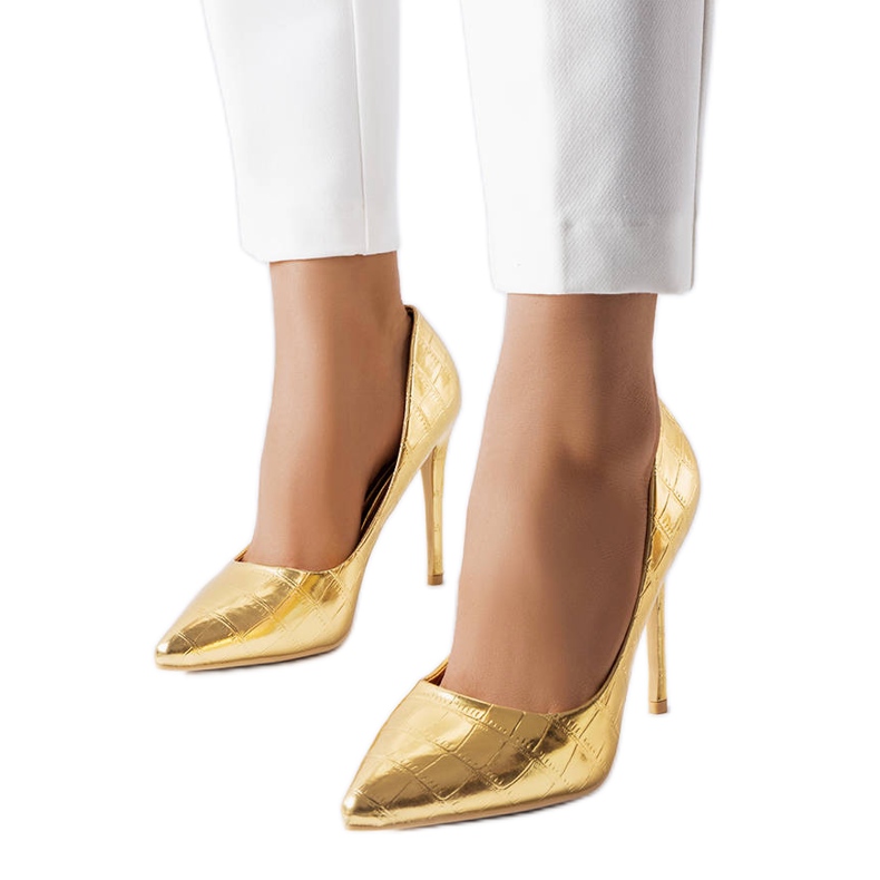 Guldnålar dekorerade med Raison-prägling gyllene