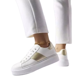 Vita sneakers med guldrand från Aurélie