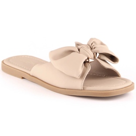 Platta sandaler för kvinnor med en beige rosett eVento 5479