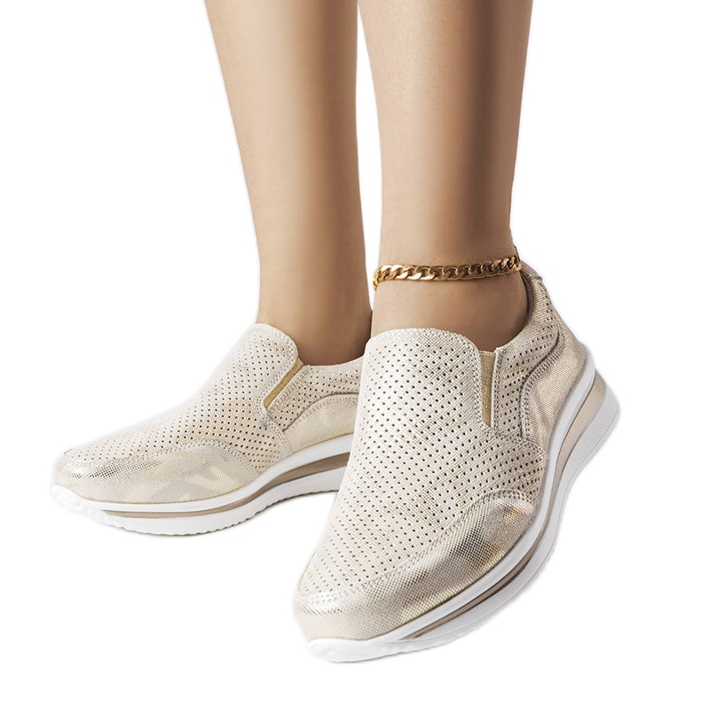 Genombrutna wedge sneakers i guld från Rhéaume gyllene