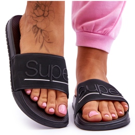 Lätta kvinnors tofflor med svart glad inskription