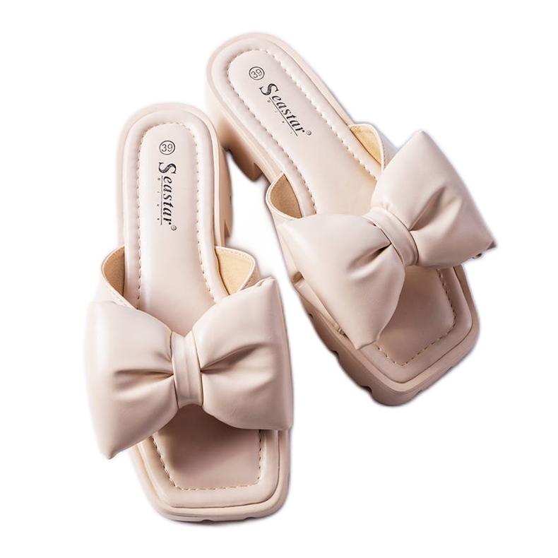 Beige traktorsula slides från Bossé