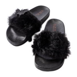 Svarta tofflor med päls från Genevre