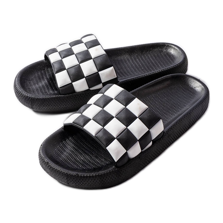 Svarta plattformstofflor i gummi från Elin