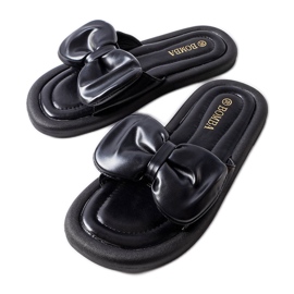 Svarta tofflor med rosett från Lende