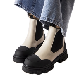 Beige och svarta slip-on boots från Sibyla