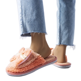 Orange tofflor med rosett