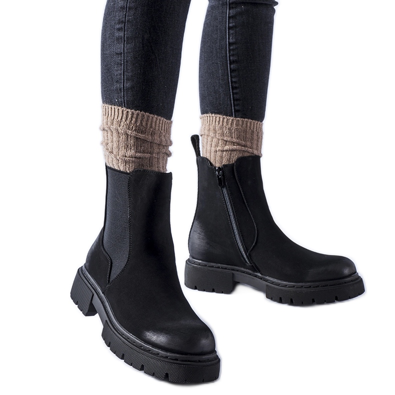 Piedalue svarta isolerade matta stövlar