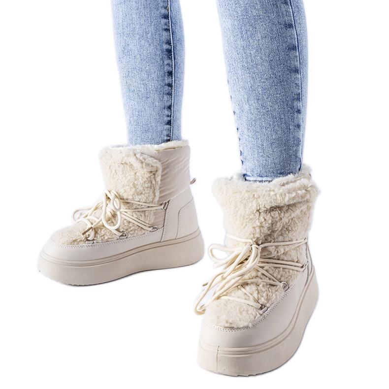 Beige snökängor på en massiv Elvio-plattform