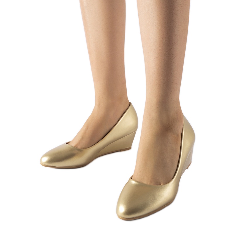 Houstons lågkiliga balettlägenheter i guld gyllene