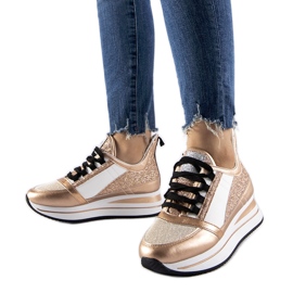 Guldglittersneakers på Marce-plattformen gyllene