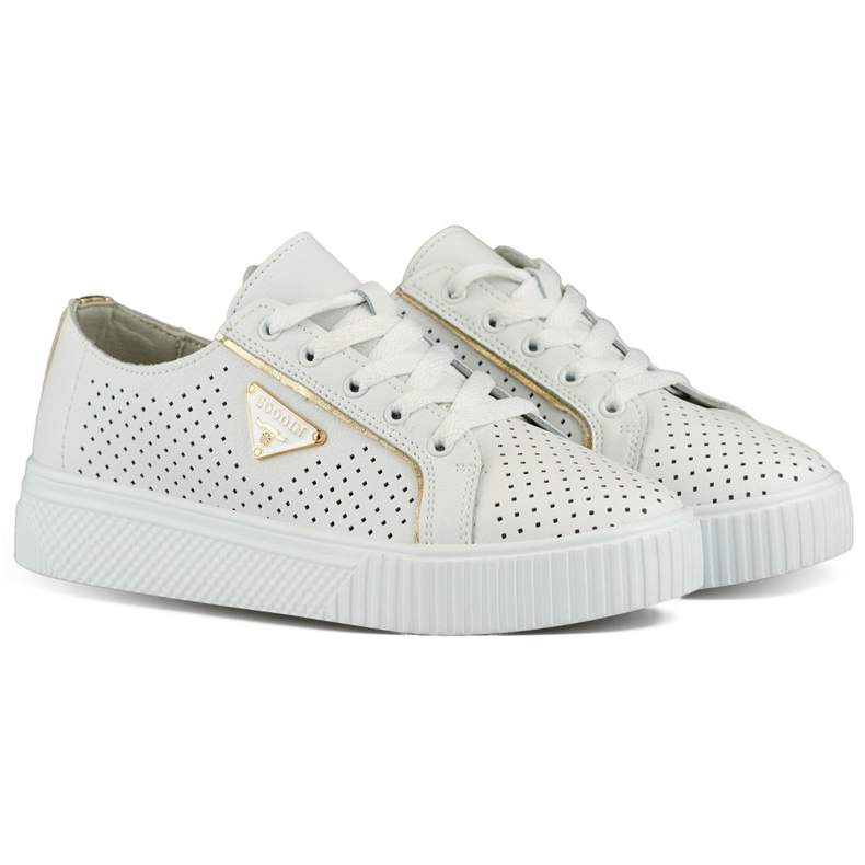 Vita genombrutna sportskor för kvinnor gjorda av naturligt läder