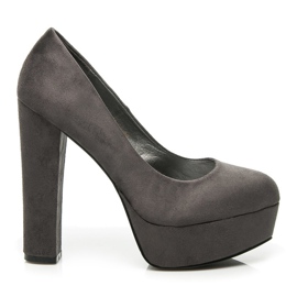 Comer Mocka pumpar på en pelare grå