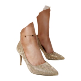 Guldglänsande höga klackar med innersula i läder gyllene