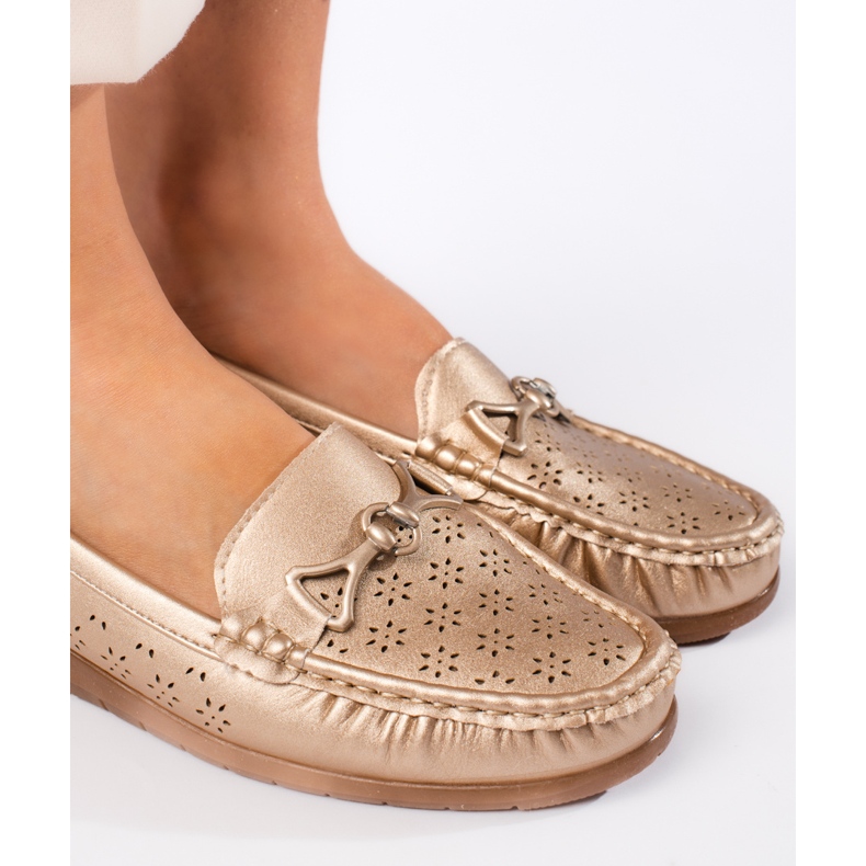 Dammockasiner i guld gyllene